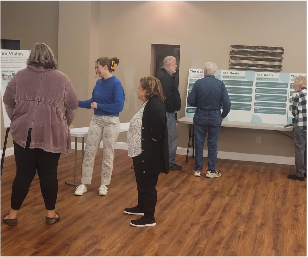 Residents at a Crossroads community open house reviewing planning materials